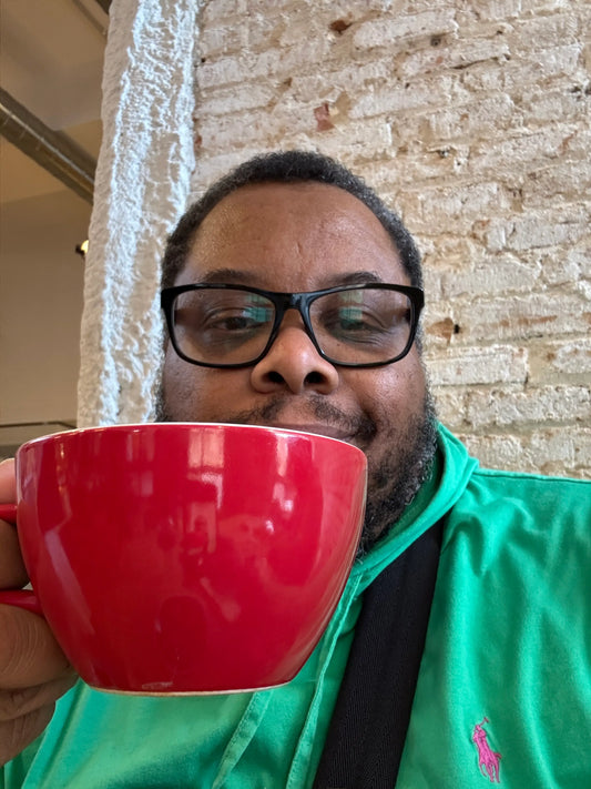 Coffee lover enjoying a fresh cup of coffee in a cozy cafe