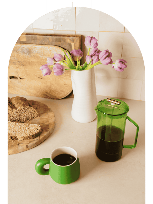 French press coffee brewing setup with freshly ground coffee